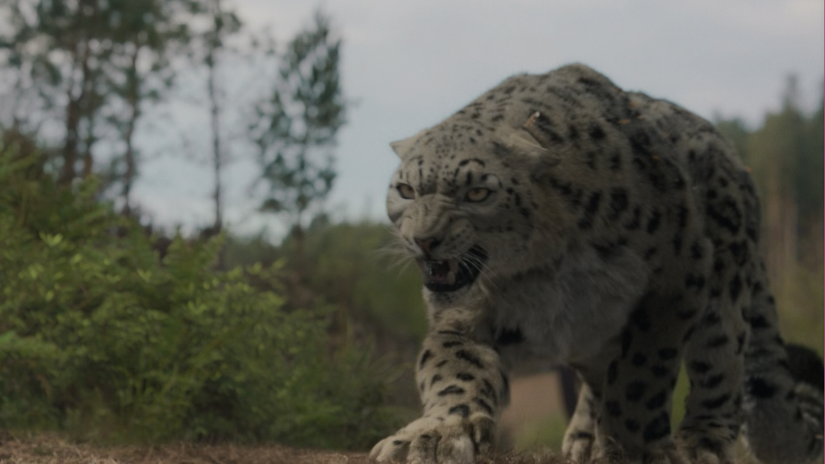 A CGI leopard is crouching, ready to pounce.