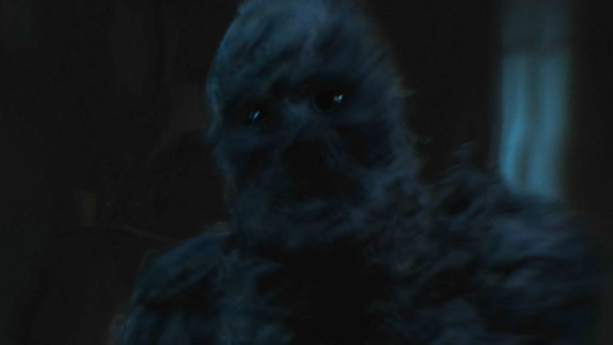 There is a dark entity who looks like made of smoke. It has glowing black eyes.
