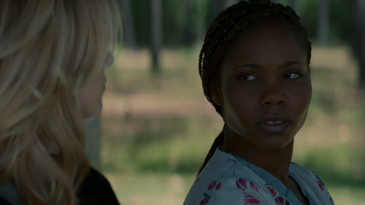 A woman is looking at another woman.
