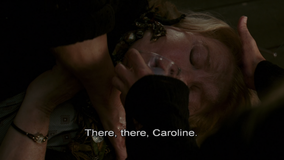 Cecile is feeding a potion to old woman Violet.